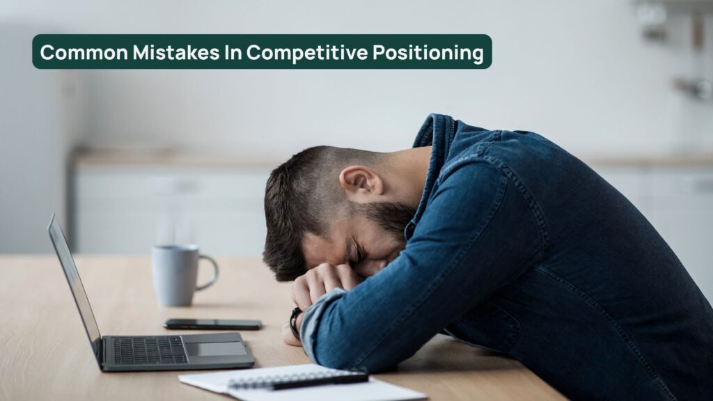 Sales person with head on desk after making mistake